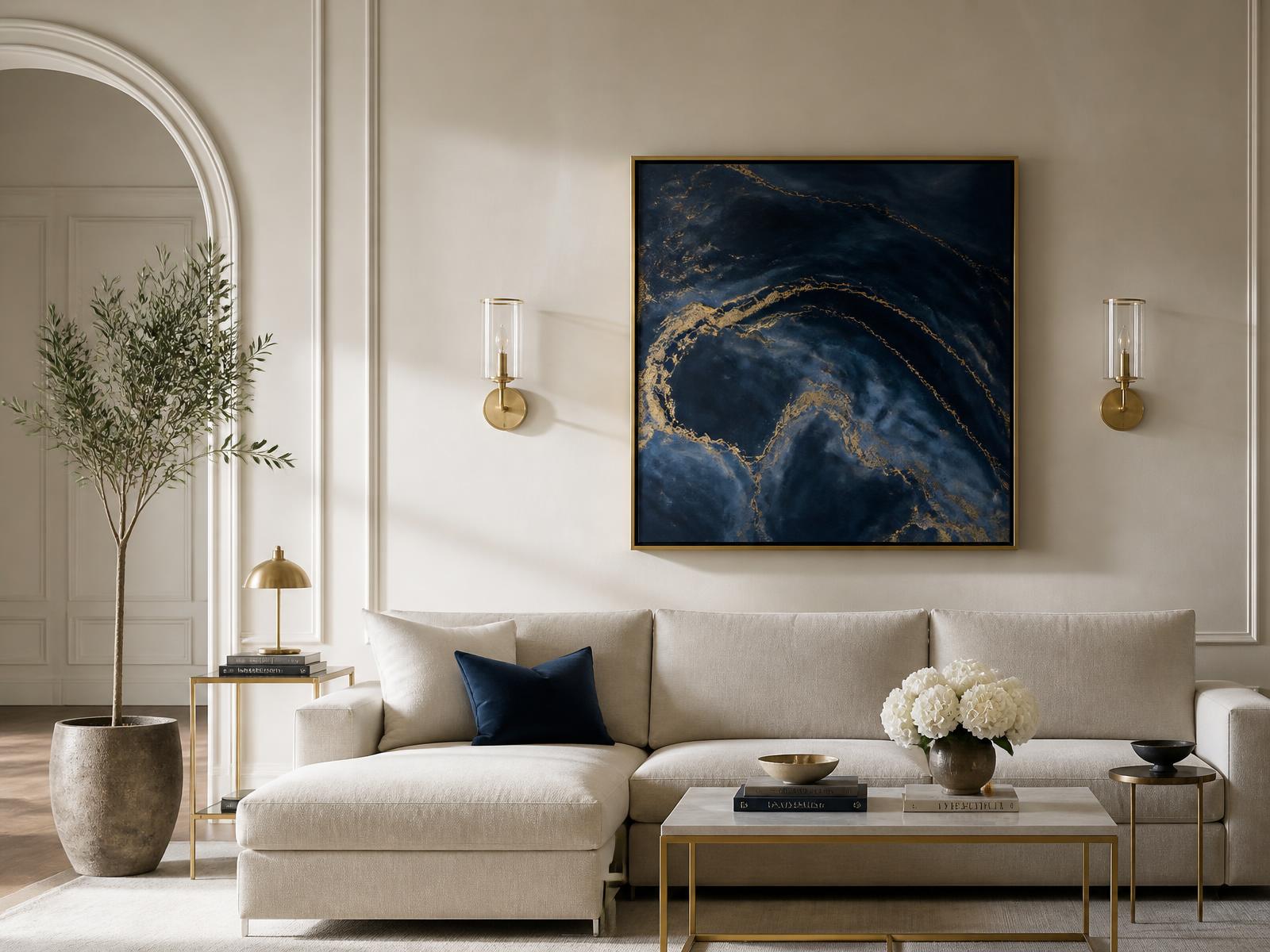 Ivory living room with a deep navy resin artwork above a linen sofa